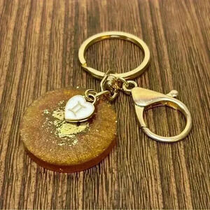 Gold Tone Keychain with Hand Crafted Zodiac Gemini Medallion and Heart Charm
